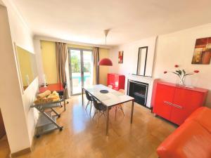 a living room with a table and a fireplace at Stunning Home with Outdoor Swimmingpool, 4 Bedrooms and Wifi in Benalmádena