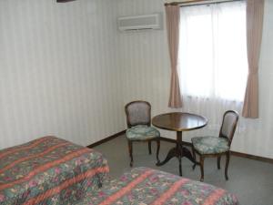 Postel nebo postele na pokoji v ubytování Gasthof Ascot + 37 fotografií