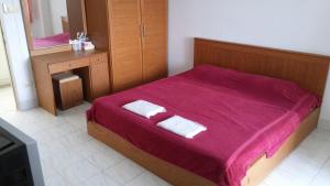 En eller flere senge i et værelse på Thana Place Charunsanitwong 34