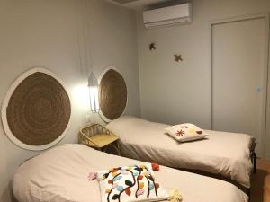 Cama ou camas em um quarto em Demeure d'exception vue mer