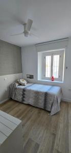Ένα ή περισσότερα κρεβάτια σε δωμάτιο στο Apartamento Arbolí