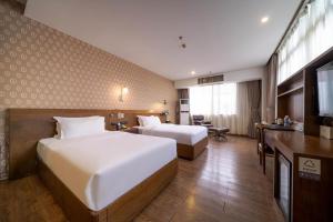 Televiisor ja/või meelelahutuskeskus majutusasutuses Xicheng International Hotel Guangzhou Sanyuanli Jiangxia Metro Station Branch
