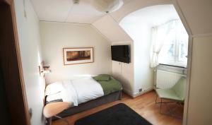 Postel nebo postele na pokoji v ubytování Wiks Slott
