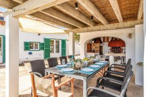 a dining room with a table and chairs at Finca Llucasaldent Menor by Menorca Vacations in Alaior