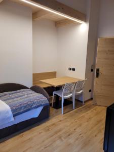 Postel nebo postele na pokoji v ubytování Garni B&B Mozart Nesthouse