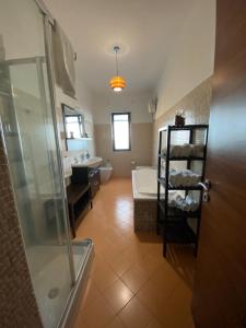 a bathroom with a shower and a toilet and a sink at casa picasso in Naples
