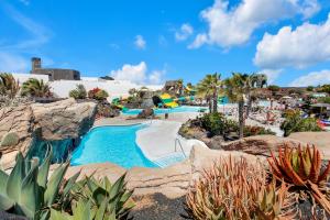 a resort with a swimming pool and a water park at Sweet Home Majanicho in Majanicho