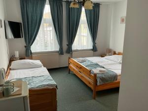 Postel nebo postele na pokoji v ubytování Pension Abbazia