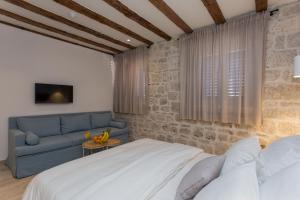 Posteľ alebo postele v izbe v ubytovaní Bifora Heritage Hotel