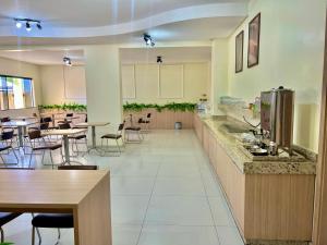 Kuchyň nebo kuchyňský kout v ubytování HOTEL GUAIRACÁ