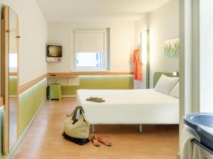 Ein Bett oder Betten in einem Zimmer der Unterkunft Ibis budget Wien Sankt Marx