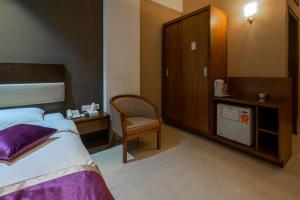 Postel nebo postele na pokoji v ubytování Hotel Ashrafee