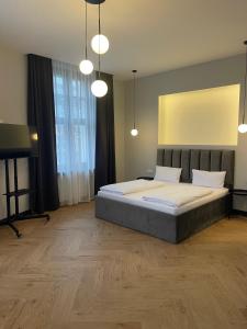 a bedroom with a large bed and a mirror at Motel Blue Messe in Berlin