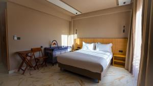 Postel nebo postele na pokoji v ubytování Hôtel Atlas Day