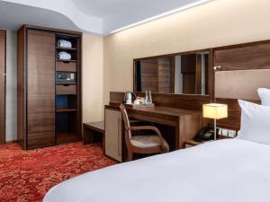 Letto o letti in una camera di Movenpick hotel Sarajevo