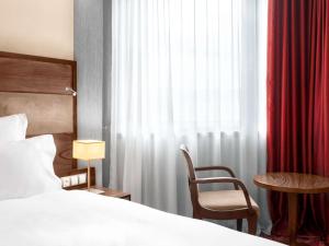 Letto o letti in una camera di Movenpick hotel Sarajevo