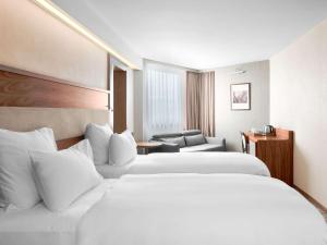 Letto o letti in una camera di Movenpick hotel Sarajevo
