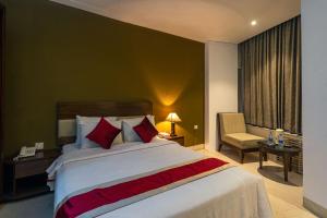Postel nebo postele na pokoji v ubytování Hotel Ashrafee
