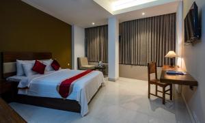 Postel nebo postele na pokoji v ubytování Hotel Ashrafee