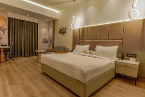 a large bedroom with a large bed and a piano at Best Western AH1 Amritsar in Amritsar