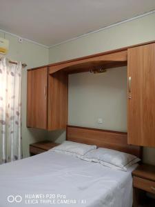 En eller flere senge i et værelse på Emam's Apartment