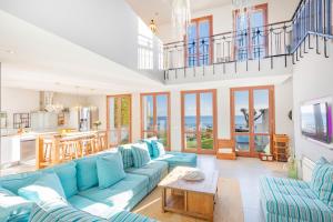 a living room with blue couches and a table at Mimar Altea Exclusive in Altea