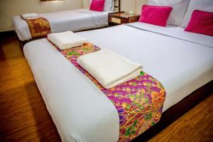 Lukmuang 2 Hotel客房内的一张或多张床位