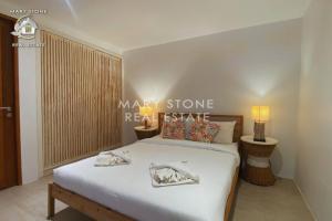 a bedroom with a large white bed in a room at Villa Azula - Stunning Seaview in Ban Bang Po +67 photos