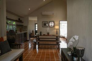 a living room with a couch and a table at 10mins to BKK airport 3BR Group Stay in Bangkok