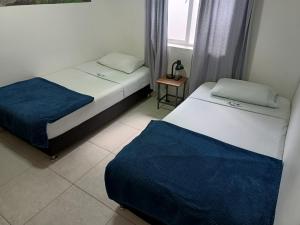 Postel nebo postele na pokoji v ubytování Air Guest House