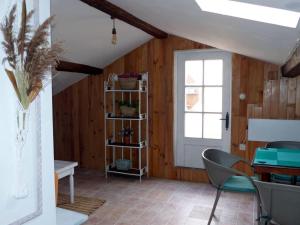 a room with a table and chairs and a window at Casa Rural Villa Huerta in Santa María de Huerta