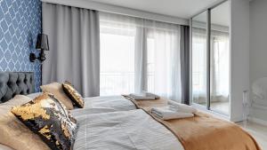 Postel nebo postele na pokoji v ubytování Comfortable Apartments with Access to the Gym Dom & House