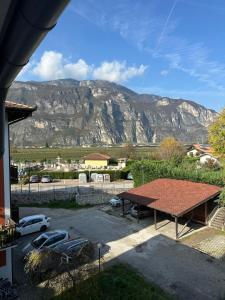 a view of a mountain from a house with a picnic table at Nave San Rocco, Trentino in Nave San Rocco
