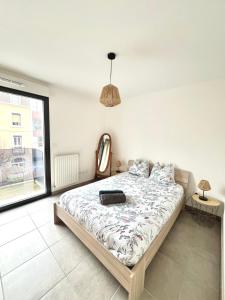 Postel nebo postele na pokoji v ubytování T2 cosy - Idéal curistes et escapade bien-être