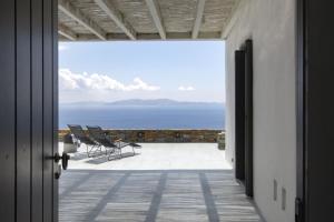 a view of the ocean from a house balcony at House G in Kardiani Tinos in Kardiani