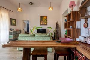 a living room with a table and a couch at Furaha Villa in Kidoti
