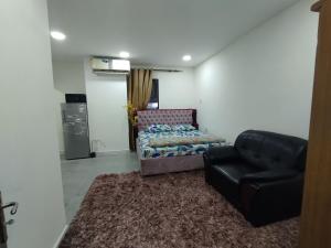 a living room with a couch and a chair at JUH Real Estate and management servise LLC in Abu Dhabi