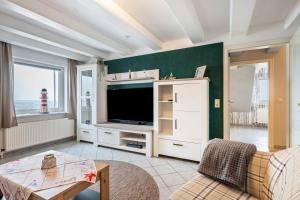 Μια τηλεόραση ή/και κέντρο ψυχαγωγίας στο Gästehaus Bi de Ley