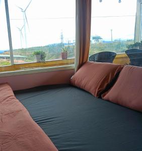 Ένα ή περισσότερα κρεβάτια σε δωμάτιο στο Homestay Nhà Ven Rừng