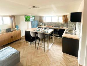 a kitchen with a table and chairs in a room at Esmeralda Holiday Home in Bracciano +19 photos