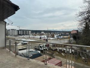 a view of a parking lot from a balcony at Podhalańska Panorama - bilard i jacuzzi in Nowy Targ