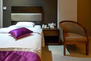 Postel nebo postele na pokoji v ubytování Hotel Ashrafee