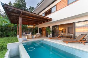 an image of a swimming pool in a house at Casa Colibri - Stunning ocean view in Santa Teresa Beach