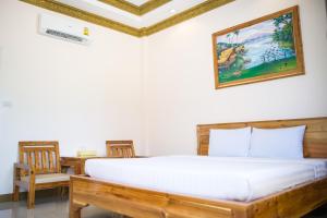Postel nebo postele na pokoji v ubytování Pailin Resort