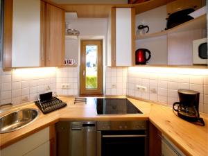 a kitchen with a sink and a counter top at Turmhaus in Schönau am Königssee