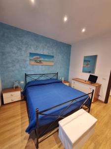Ένα ή περισσότερα κρεβάτια σε δωμάτιο στο Casa Azzurra