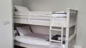 Postel nebo postele na pokoji v ubytování Trivia House