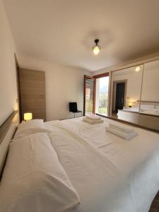 Postel nebo postele na pokoji v ubytování Manuel Guesthouse Arta terme