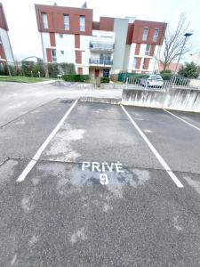 a parking lot with the word written on it at L'Apollinaire - 34m2 avec balcon et parking privé in Saint-Apollinaire