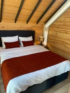 a bedroom with a large bed in a wooden room at Luna Home Club in Samandağı +21 photos